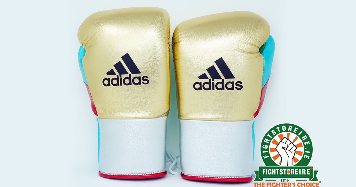 white and gold adidas boxing gloves